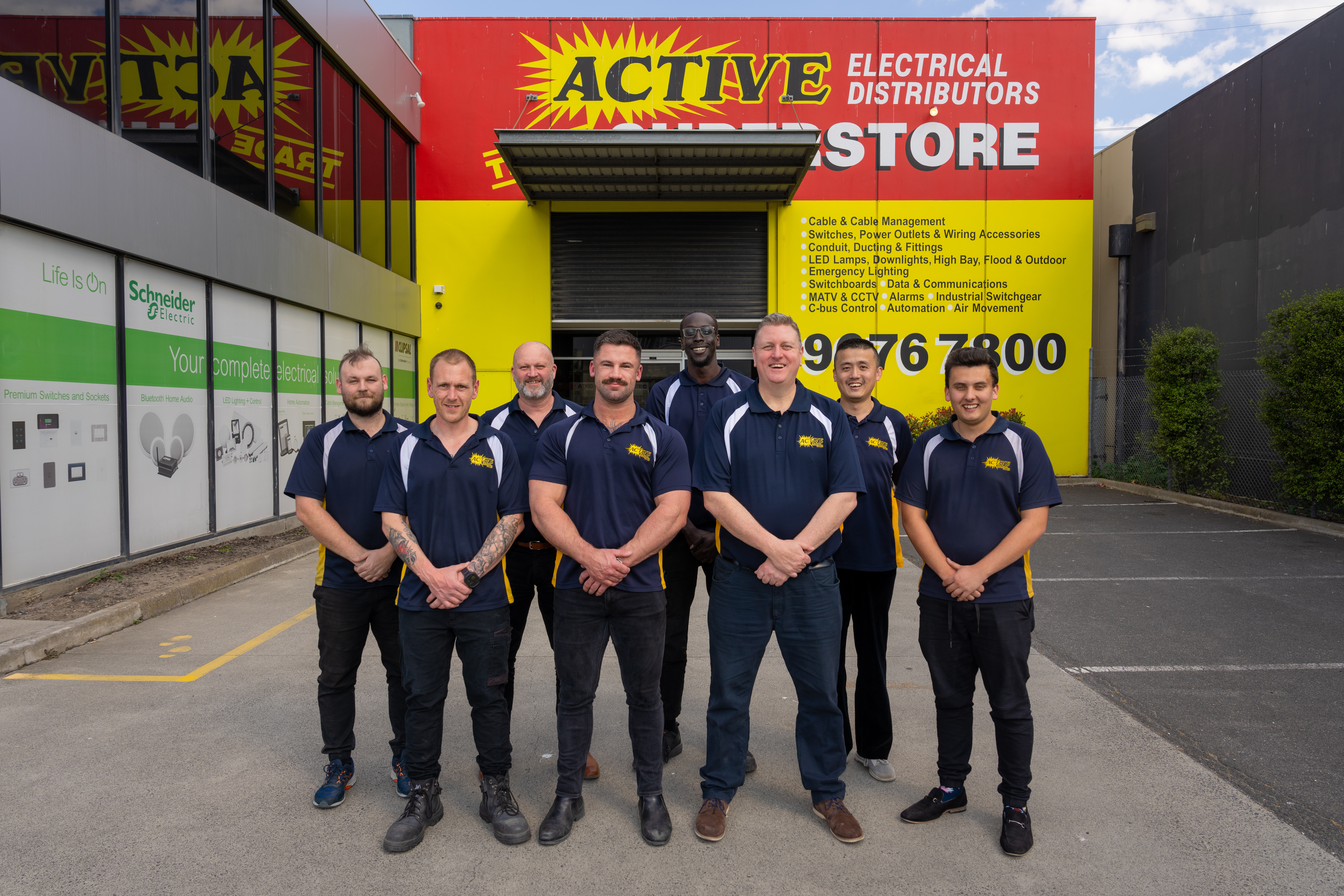 A group of people with security gear discussing on an open field